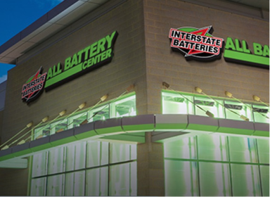 Outdoor night view of an Interstate Batteries All Battery Center store.